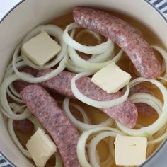 a pot filled with meat, onions and cheese