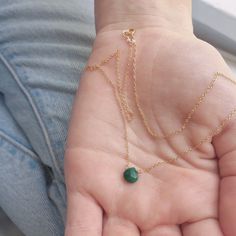 This emerald necklace is the May birthstone and has a genuine faceted emerald gemstone that sits on a dainty chain below the collarbone. Subtle and simple, this beautiful semi-precious stone necklace is perfect by itself or for layering with other necklaces. These are genuine emerald gemstones. All necklaces are handmade by us in NYC and each necklace is made to order using the highest quality materials and handpicked genuine gemstones. Length on the model is 16 inches. ▹ F A Q What is 14k Gold- Emerald Necklace Simple, Emerald Necklace Gold, Gold Emerald Necklace, Necklace Emerald, Gold Necklace Simple, May Birthstone, Necklace Simple, Emerald Necklace, Necklace Minimalist