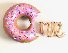 Sweet ONE Birthday Balloon banner includes a pink donut balloon plus N + E letter balloons in gold 2nd Birthday Party For Girl, 1st Birthday Party For Girls, Floating Balloons, Donut Birthday Parties, Second Birthday Ideas, Donut Birthday, 2nd Birthday Party Themes