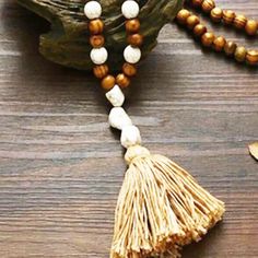 Brand New No Tags - Handmade This Is A Handmade Piece That Is Made From Natural Items The Stones Are Scattered Throughout The Beads The Linear Length Of The Beads Alone Is About 42 Inches The Tassel Is Made From Stones And Yarn The Tassel Adds A Beautiful Touch To Balance The Design #4 Bohemian Beige Necklaces With Wooden Beads, Bohemian Beige Necklace With Wooden Beads, Bohemian Beige Jewelry For Meditation, Bohemian Beige Beads For Beach, Beige Bohemian Beads For Beach, Bohemian Beige Beach Beads, Adjustable Beige Beaded Bohemian Necklaces, Adjustable Beige Beaded Bohemian Necklace, Adjustable Beige Bohemian Beaded Necklaces