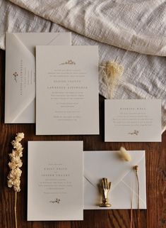 the wedding stationery is laid out and ready to be put into their guests'envelopes