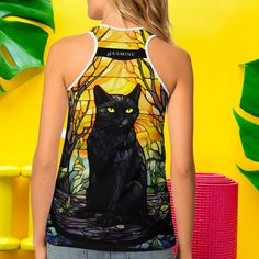 a woman wearing a tank top with a black cat on it's chest and yellow eyes