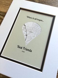 a white frame with a black border holding a map and the words best friends written on it