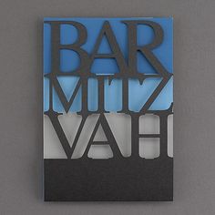 a sign that reads bar mitz vah on the side of a gray wall