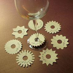 several wine glasses with wooden gears on them