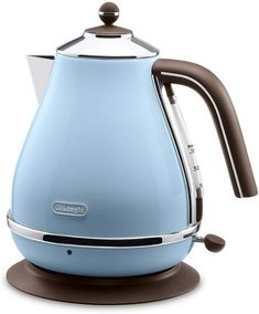 an electric kettle with a brown handle