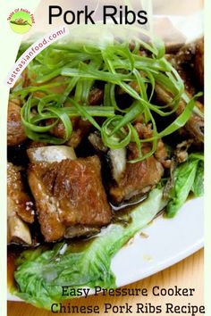 pork ribs with green onions and chinese pork ribs recipe on a white plate topped with lettuce