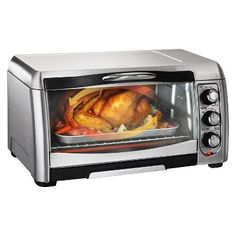 a silver toaster oven with a turkey in it