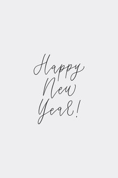 the words happy new year written in cursive writing on a white background with black ink