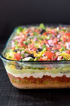 a casserole dish filled with lots of different toppings on top of it