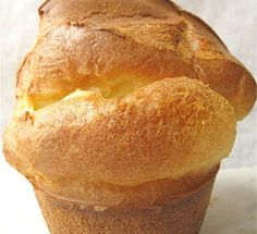 a close up of a muffin on a white surface