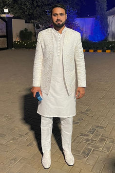 Our esteemed happy client, Pakistani star cricketer Mr. Faheem Ashraf looking absolutely stunning in open front white prince coat with kurta pajama designed by Uomo Atire.

- It's custom-made, so it's guaranteed to fit you perfectly. Sf Fashion, Prince Suit, Month Challenge, Prince Coat, Kurta Pajama, Wedding Picture, Shalwar Kameez, White Silk, Suit Fashion