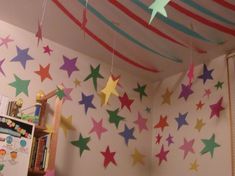 colorful stars hanging from the ceiling in a child's room