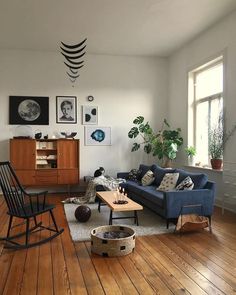 a living room filled with furniture and wooden floors