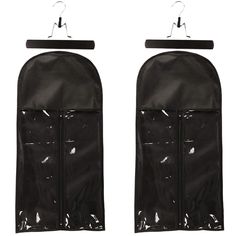 two black garment bags hanging from hooks on a white background with clippings attached to them