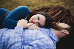 a man and woman laying on top of each other