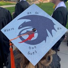 a blue graduation cap with an eagle on it and the words, where we do one goes