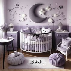 a baby's room decorated in lavender and white with stars on the moon wall