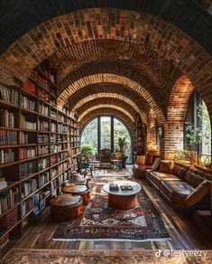 a living room filled with furniture and bookshelves covered in lots of bookcases