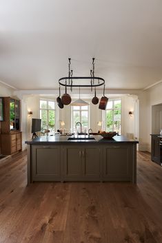 a large kitchen with an island in the middle