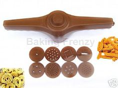 various types of pasta cutters and graters on a white background with other items