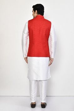 Red silk bundi with all over stripe pattern, tonal thread, sequin embroidery and patch pockets. Paired with full sleeves kurta and straight pant. - Aza Fashions Red Festive Nehru Jacket For Festivals, Red Winter Festive Kurta, Red Nehru Jacket For Diwali Festivities, Red Nehru Jacket For Festive Occasions, Red Nehru Jacket For Festive Winter Occasions, Red Festive Nehru Jacket For Winter, Festive Semi-stitched Straight Nehru Jacket, Winter Festive Red Kurta, Fitted Red Nehru Jacket For Festivals