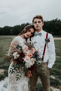 a man and woman standing next to each other in front of an instagram page