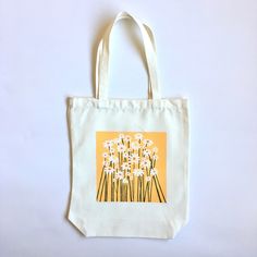 Hand painted 15x13 inch tote bag, with a 9 inch strap. Durable, and a unique piece of original art! Great for shopping, carrying books, groceries, gong to the beach, etc. Can be washed, steamer recommended for removing creases. White Square Canvas Bag For Spring, White Canvas Bag With Removable Pouch As A Gift, Artistic Bags For Everyday Use In Spring, White Flower Shoulder Bag For Shopping, White Flower-shaped Shoulder Bag For Shopping, Artistic Tote Bags For Spring, Artistic Spring Tote Bag, Eco-friendly White Shoulder Bag With Dust Bag, White Flower Shoulder Bag For Everyday Use