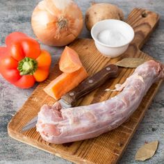 the ingredients to make this dish include ham, potatoes and carrots on a cutting board