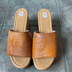 New!! Size 9 Fits True To Size. Trendy Brown Leather Mules, Trendy Brown Wedge Sandals For Spring, Trendy Brown Mules For Summer, Trendy Brown Open Toe Mules, Trendy Brown Wedge Sandals With Round Toe, Brown Platform Wedge Heel Mules, Trendy Brown High Heel Wedge Sandals, Trendy Brown Mules For Spring, Brown Leather Wedge Heel Mules