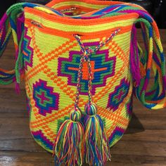 Each Bag Is Handmade In The Guajira By The Wayuu Tribe Takes 10-15 Hours And Is One Of A Kind Casual Yellow Shoulder Bucket Bag, Yellow Pouch Bag For Shopping, Summer Yellow Crossbody Bag, Casual Yellow Bucket Bag For Daily Use, Casual Yellow Crossbody Bag, Yellow Rectangular Bucket Bag For Vacation, Casual Multicolor Bucket Shoulder Bag, Multicolor Satchel Bucket Bag For Summer, Yellow Rectangular Bucket Bag For Travel