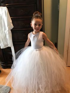 This listing is for a flower girl tulle tutu skirt. The body suit and jacket are not included but I can recommend a site where they can be purchased. The skirt is made of tulle and an elastic band. There are multiple colors that the skirt can be made in. I prefer to make the items to order so message me if you would like something similar to what is shown. (Different color/add ribbon/etc.)  Prices are based on sizes and material that is being used. Princess Style Tulle Tutu Dress For First Communion, Spring Pageant Tutu Dress With Tulle Skirt, Fitted Princess Tutu Dress For First Communion, Princess Style Fitted Tutu Dress For First Communion, Spring First Communion Tulle Tutu Dress, Tulle Tutu Dress For Pageants, Tulle Tutu Dress For Pageant, Fitted Tulle Tutu Dress For Pageant, Fitted White Tutu Dress With Tulle Skirt