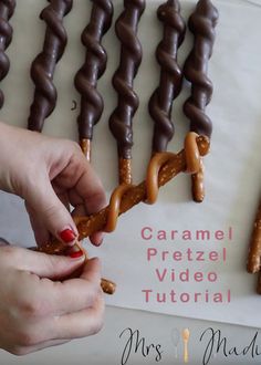 someone is decorating some chocolate pretzels on a sheet of paper with the words caramel pretzel video tutor