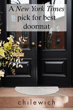 a black door with the words, a new york times pick for best doormat