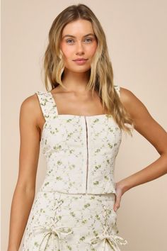 Sunny days were meant for impressing your crush in the Lulus Delightful Flirt Ivory Twill Floral Embroidered Tank Top! Sturdy woven twill shapes this cute top that boasts an embroidered floral design throughout. Wide straps (with decorative lace-up details) support a fitted bodice with a square neckline and a hook-and-eye placket at the front. Cropped hem completes the look. Pair with the matching skirt for a complete look! Fit: This garment fits true to size. Length: Size medium measures 18" fr Embroidered Tank Top, Embroidered Tank, Floral Crop Tops, Your Crush, Cute Top, Tank Top Cami, Cami Tanks, Wide Straps, Fitted Bodice