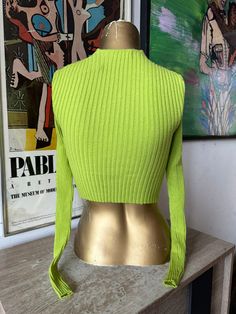 Expertly crafted with a crisscross neck detail, this UO Ribbed top in size XS offers a modern twist on a classic design. The rich green hue adds a pop of color to your wardrobe, making it a versatile and stylish addition that will elevate any outfit. Perfect for both casual and dressy occasions. Size: Extra Small This item is preloved Ribbed Knit Top, Ribbed Top, Criss Cross, Ethiopia, British Indian, Brunei, Ribbed Knit, Knit Top, Classic Design