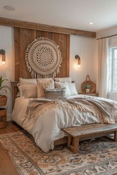 a large bed sitting in a bedroom on top of a wooden floor next to a window