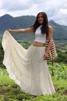 From Twist and Crinkle Collection It's a similar skirt to my smock elastic waist skirts.For those people who prefer the smaller waistband  The color is natural cotton which is an off-white color. This lovely Boho piece is made from 100% cotton. It's half-lined with an elastic waistband. and ties The skirt is in 5 tiers. It's a great piece to wear with a tight or cropped top. It is very comfortable to wear and easy to care for, no need to iron just twist and crinkle and tie it with an elastic to Low Waisted Maxi Skirt Outfit, Beige Festival Skirt, Festival Beige Tiered Skirt, Beige Tiered Maxi Skirt For The Beach, Beige Cotton Beach Skirt, Long Flowy Skirt Outfit, Long Tight Skirt, Long Boho Skirt, Onam Outfits