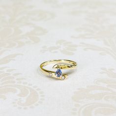 14K Yellow Gold Estate Pear Shaped Tanzanite Ring with Diamond Accents. Size 6 1/2. Weighs 1.6 grams. Gold Tanzanite Diamond Ring Fine Jewelry, Yellow Gold Tanzanite Rings With Accent Stones, Gold Tanzanite Rings For Anniversary, Tanzanite Yellow Gold Birthstone Ring As Gift, Yellow Gold Tanzanite Birthstone Ring For Gift, Gold Tanzanite Birthstone Promise Ring, Gold Oval Birthstone Ring With Tension Setting, Oval Gold Birthstone Ring With Tension Setting, Classic Gold Tanzanite Ring