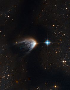 an object in the sky with stars around it