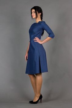 "An asymmetrical dress featuring fit and flare silhouette, midi length, and 3/4 sleeves. - asymmetrical v-neck - 3/4 sleeves - flared skirt with inverted front pleat - fit and flare silhouette - midi length - extraordinary dart in the front - concealed back zipper closure Color: dark blue Fabric: cotton - 95%, elastane - 5% For Size S (6 US): dress length - 40\" (101 cm), sleeve length - 15,3\" (39 cm) Our model wears size S (06) and is 171 cm/5'6\" tall Model in the photo: 64,5\" (164 cm) heigh Fitted A-line Asymmetrical Dress For Cocktail, Modern Knee-length Asymmetrical Dress For Formal Occasions, Modern Fitted Knee-length Asymmetrical Dress, Modern Fitted Asymmetrical Knee-length Dress, Fit And Flare Midi Dress For Semi-formal Occasions, Modern Fitted Asymmetrical Midi Dress, Modern Asymmetrical Dress For Spring Formal, Knee-length Midi Dress With Flattering Cut For Cocktail, Modern A-line Midi Cocktail Dress