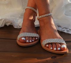 These beautiful bridal sandals are definitely one of our best models with an elegant embroidered finish with pearls and beads that are sewn by hand on leather straps Full sizes only ** If you have half the size, go UP to the nearest full size. ** If you are unsure of your size, please contact me so I can assist you. Check out our other wedding sandals here: MORE WEDDING SANDALS: https://www.etsy.com/listing/932339383/wedding-sandals-lace-wedding-shoes-beach?ref=shop_home_feat_4&pro=1&frs Beaded Open Toe Sandals For Wedding, Summer Open Toe Pearl Wedding Shoes, Summer Wedding Pearl Open Toe Shoes, Elegant Beaded Wedding Sandals, Summer Wedding Embellished Sandals, Embellished Wedding Sandals With Open Toe, Embellished Open Toe Wedding Sandals, Embellished Open Toe Sandals For Wedding, Embellished Closed Toe Sandals For Wedding