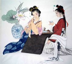 two geisha women sitting on the ground next to a vase with flowers in it