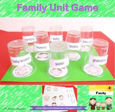 the family unit game is filled with water bottles and labels for each child's name