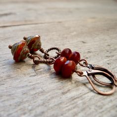 Perfect for fall! The beads on these earrings are all Czech glass beads. They are a mix of oranges. They are available with antique brass or copper findings. They are also available with titanium ear wire. The bottom bead is 10mm, Saturn shaped bead with a Picasso finish. The top beads are a terra cotta and clear dark red (almost Burgundy) bead they are 4x7mm. This listing is for the earrings shown in the first few photos. NOTE: If you want titanium, but prefer copper on the rest of the earrings Rustic Orange, Orange Tulips, Orange Earrings, Fall Earrings, Lake Forest, Jewelry Boho, Pretty Earrings, Delicate Earrings, Earrings Boho