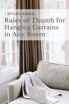 a couch sitting in front of a window with the words rules of thumbs for hanging curtains in any room