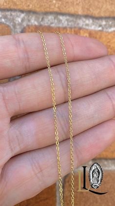 Discover versatile elegance with our Cable Link Chain, designed to be the perfect accessory for both women and children. Measuring 17 inches in length and crafted with a delicate 1mm thickness, this chain offers a refined, lightweight feel that complements any style. PRODUCT DETAILS * Material: 18K Gold Filled * Metal Purity: 18K * Chain Size: 17" Inches * Chain Thickness: 1mm * Chain Style: Cable Link * Gender: Female * Clasp Type: Lobster Claw * Age Group: Kids and Youth * Condition: 100% BRAN 16 Inch Yellow Gold Chain Necklace As A Gift, Dainty Gold Hypoallergenic Chain Necklace, 16 Inch Yellow Gold Chain Necklace Gift, Dainty 16 Inch Chain Necklace Gift, Dainty 16-inch Chain Necklace Gift, 16 Inch 14k Gold Chain Necklace For Gift, 14k Gold 16 Inch Chain Necklace As Gift, Adjustable Link Chain Necklace Gift, Adjustable Link Chain Necklace As Gift