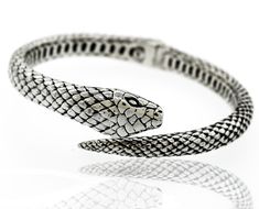 Sterling silver handcrafted designer cuff bracelet with an elegant textured snake design. Material: .925 Silver Finish: Oxidized Elegant Snake-shaped Bangle As Gift, Elegant Engraved Snake-shaped Jewelry, Adjustable Luxury Snake Bracelets, Adjustable Luxury Snake Bracelet, Luxury Adjustable Snake Bracelets, Luxury Adjustable Snake Bracelet, Elegant Handmade Snake Ring, Elegant Adjustable Snake Bangle, Elegant Handmade Snake-shaped Jewelry