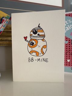 a greeting card with a cartoon character holding a heart in it's hand and the words bb - mine on it