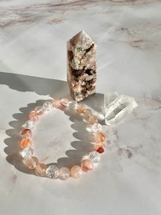 "This is a 3 piece crystal set that consists of a Druzy Pink Amethyst tower, a Himalayan Quartz, and a Fire Quartz bracelet. 1) Pink Amethyst Tower measures 2.45\" tall. 2) Himalayan Quartz Point measures 1.50\" 3) Fire Quartz (Hematoid) Bracelet has a combination of Hematoid quartz and rainbow clear quartz beads. Fits 6.25\" wrists. You will be receiving the exact pieces as shown." Rose Quartz Bracelet Beads, Hematoid Quartz, Fire Quartz, Himalayan Quartz, Reiki Crystals, Reiki Healing Crystals, Hematite Bracelet, Rose Quartz Beads, Quartz Beads